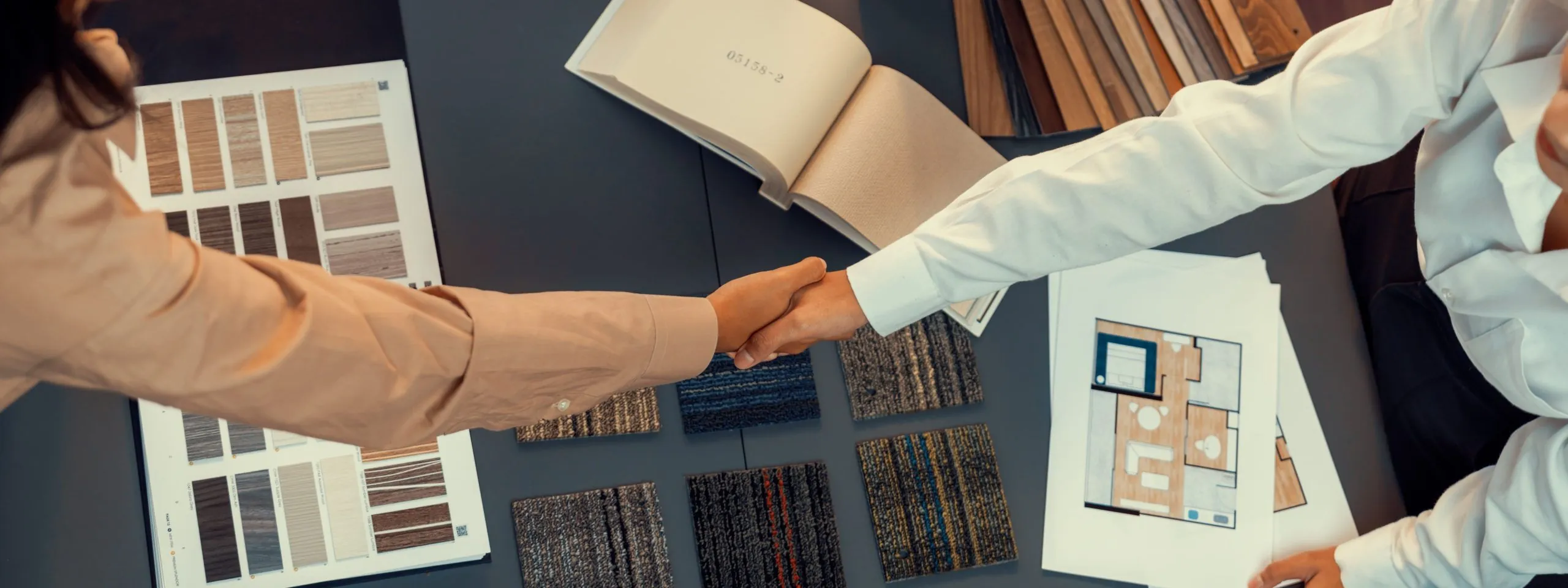 Interior designer shake hand with client or colleagues after made successful sketching