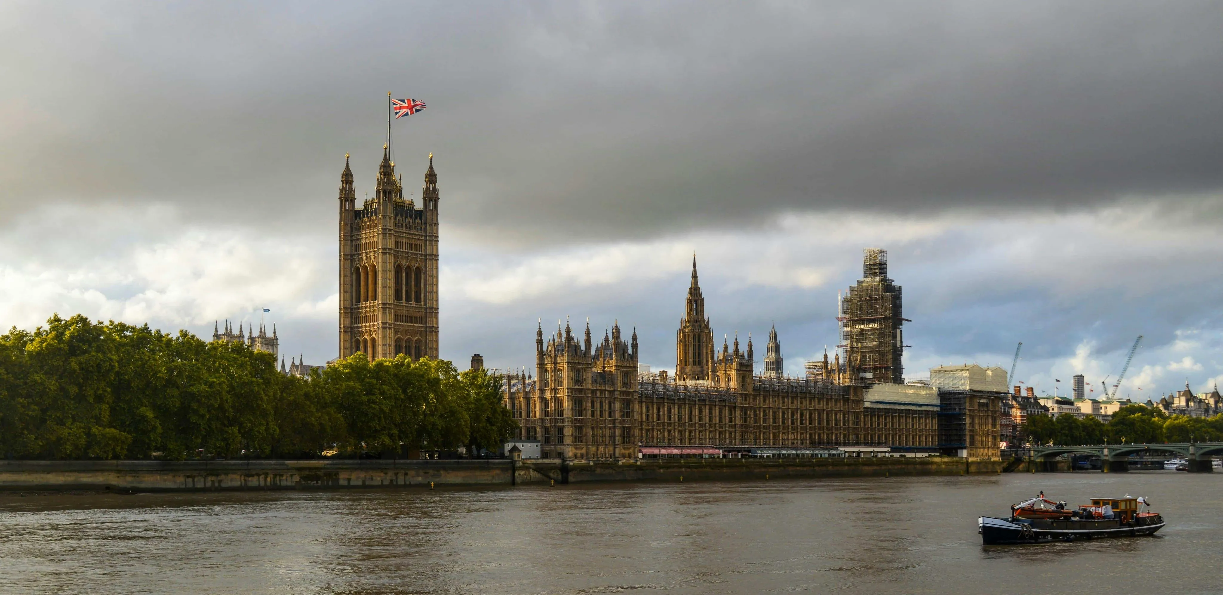 The Palace of Westminster in front of the Thames in the UK 