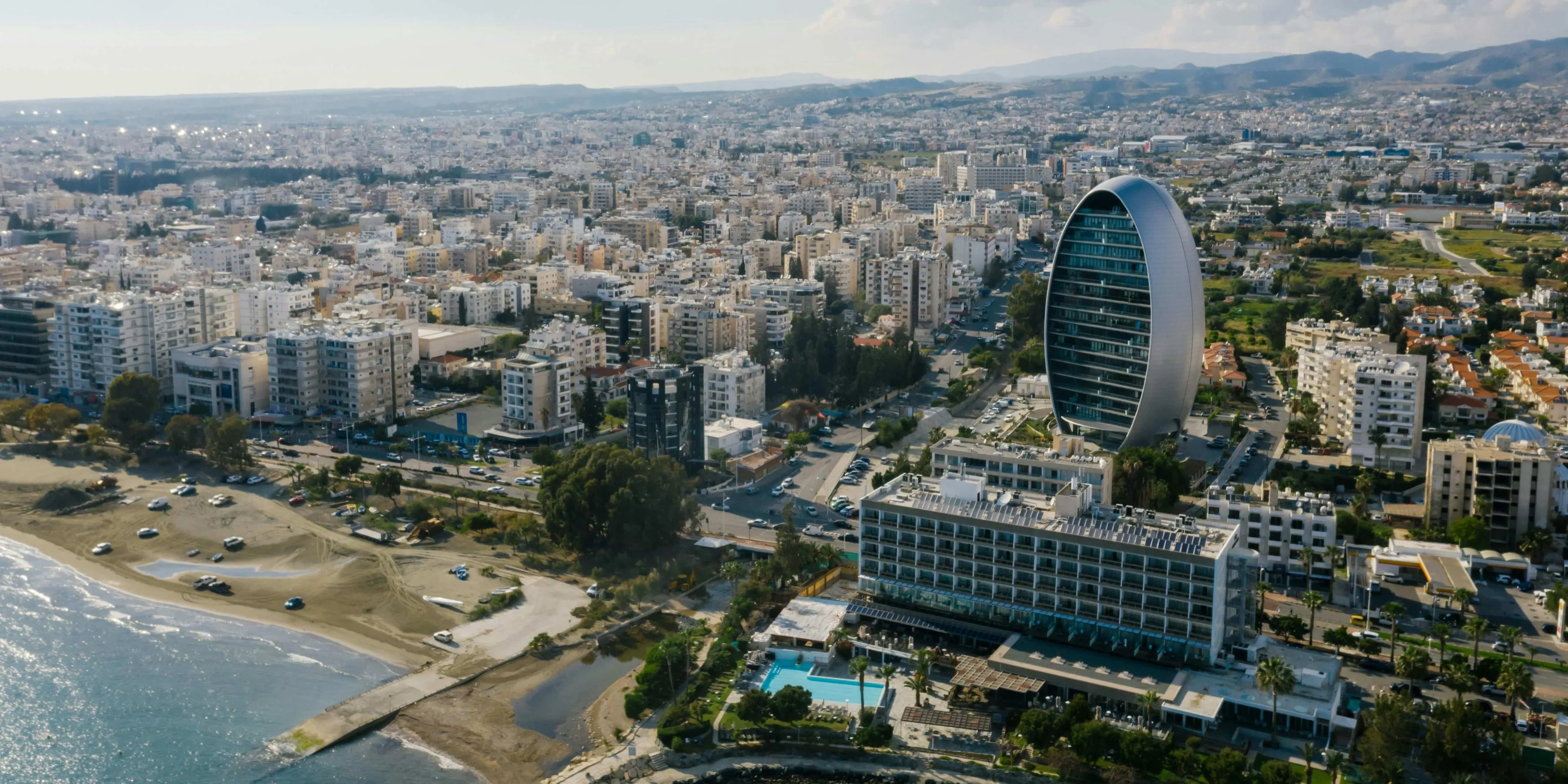 Aerial View of a Modern City Near a Body of Water