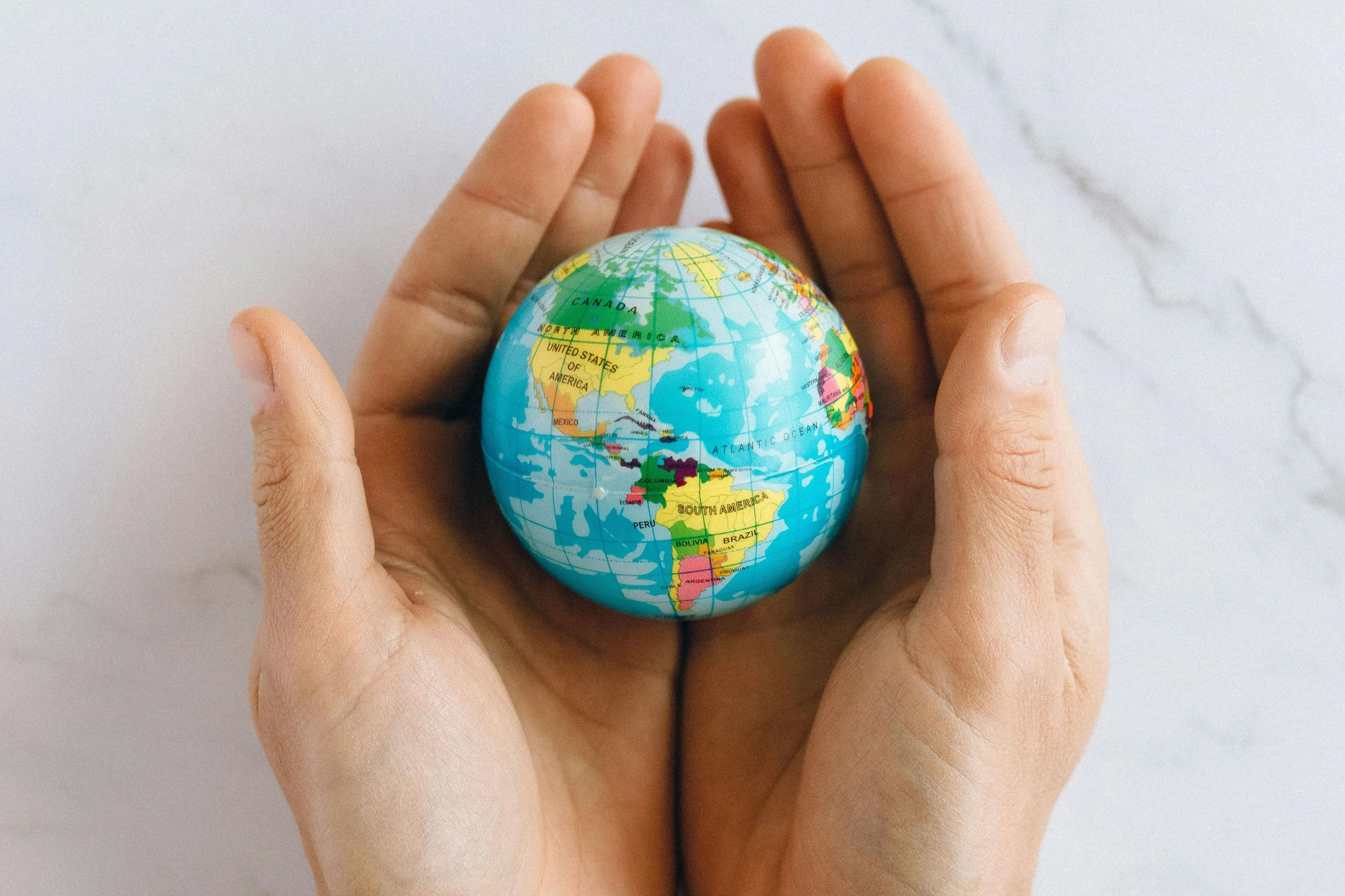 Global Property Outlook Hands holding globe