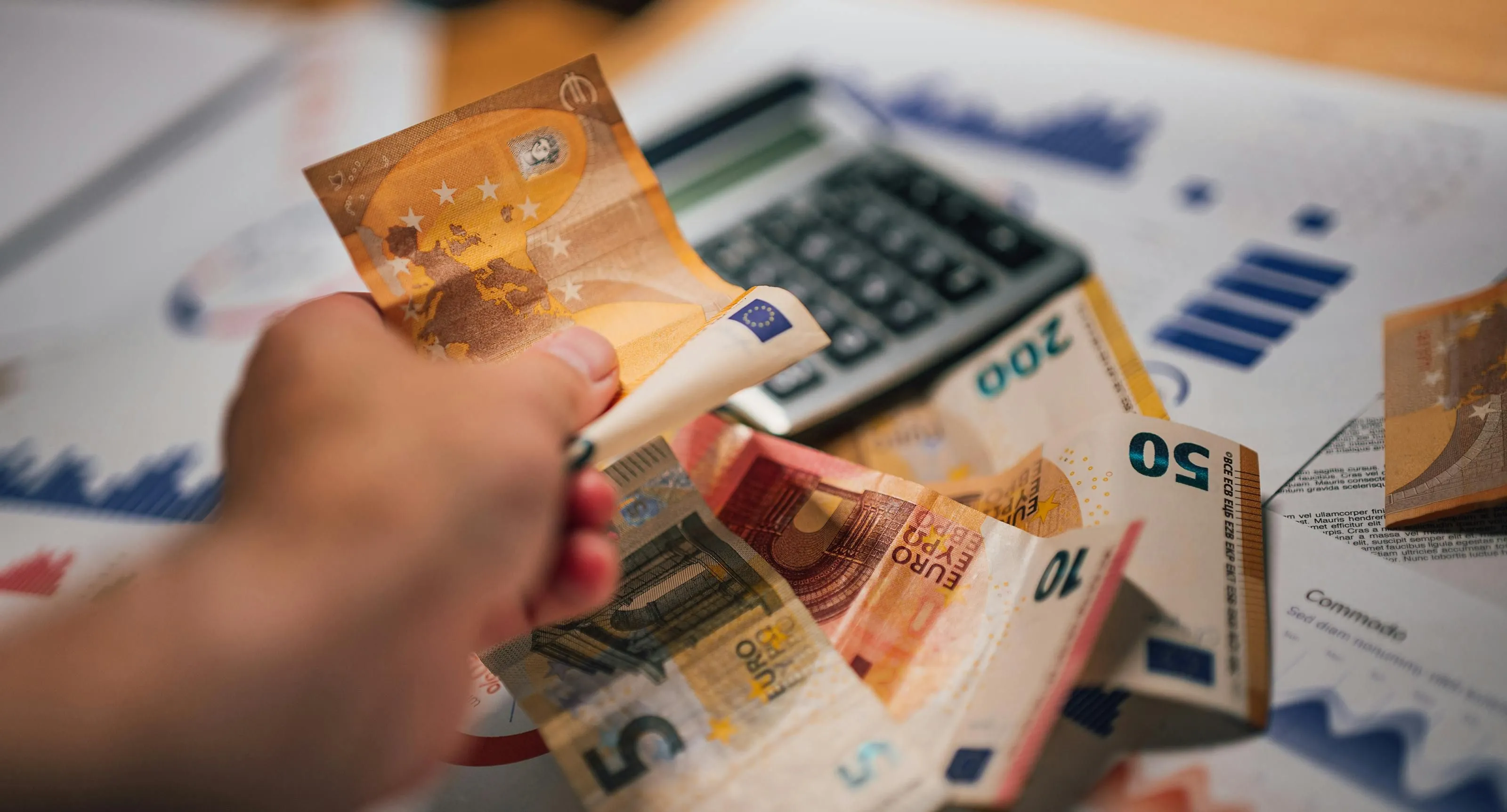 buying a home to live in Euro Banknotes with Financial Documents and Calculator