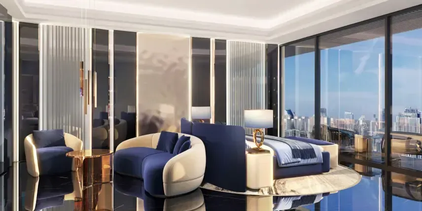 Ultra-luxury penthouse bedroom in Dubai with floor-to-ceiling windows, city skyline view, and elegant blue-gold interior design